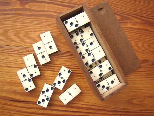 A Civil War period boxed set of 28 bone and ebony dominoes circa 1865